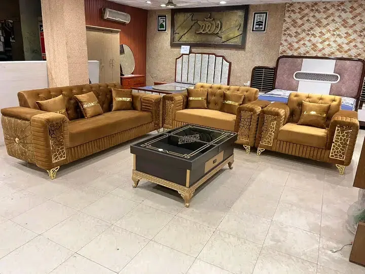 Velvet sofa set with carved gold trim and a coffee table